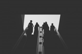 Figures on escalator
