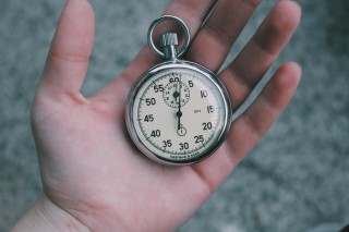 Hand holding pocket watch