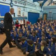 Headteacher returns to school months after life was saved by defibrillator he installed
