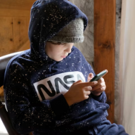Children limiting own smartphone use to manage mental health, survey finds